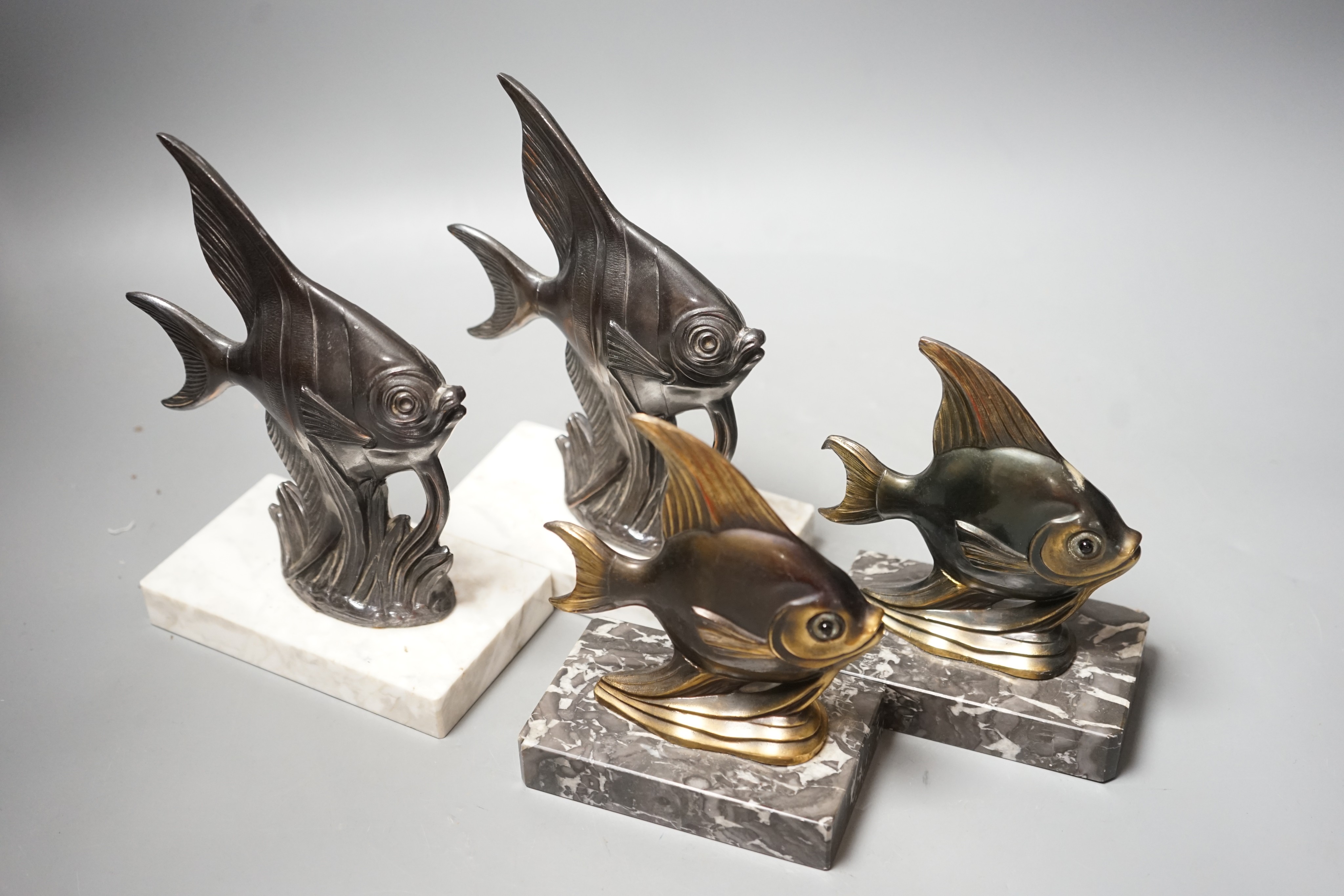 Two pairs of Art Deco spelter 'Angel fish' bookends. Tallest pair 20cm